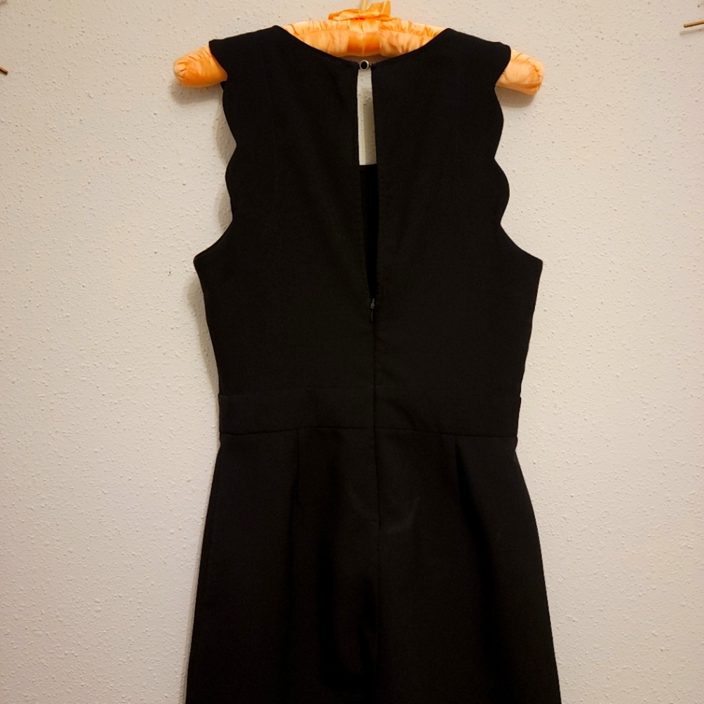 black scalloped body suit.